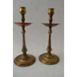 W.A.S. Benson (1854-1924) A pair of Arts & Crafts copper & copper alloy candlesticks, with turned co