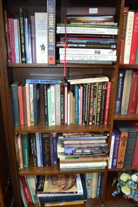 Five shelves of predominantly hardback books on a wide variety of subjects