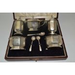 William Neale & Son Ltd. A cased silver condiment set, the pieces of octagonal form,