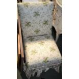 A single nursing style chair, covered with glazed cotton chintz