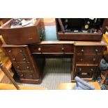 A late 19th century twin pedestal desk with leather insert top