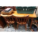A pine kitchen table and four chairs