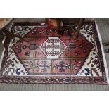 A woven woollen Iranian floor rug, 150cm x 106cm (localised wear)