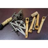 A bone handled straight pull corkscrew with dusting brush, a collection of French picnic corkscrews,