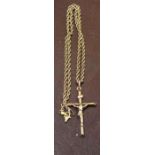 A 9ct gold Crucifix on a 9ct gold rope twist chain, combined weight 10g