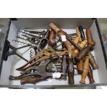 A quantity of assorted corkscrews, mostly wooden handled straight pulls, a few with dusting brushes