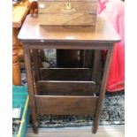 An early 20th century side table with magazine shelf under tier