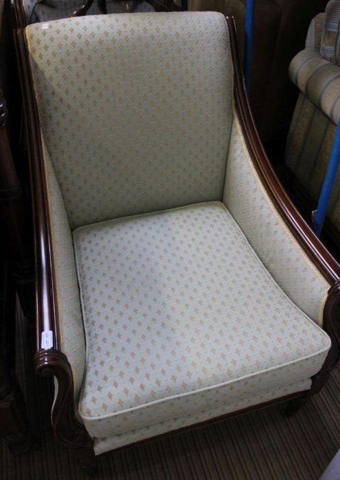 a pair of fancy framed well upholstered armchairs