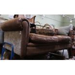 a large two seater brown leather chesterfield style sofa