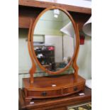 Modern yew wood swinging bedroom mirror over two drawers