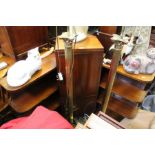 A 1930's corner drinks cabinet flanked by open shelves