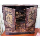 An Oriental table top cabinet of small proportions