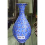 A Middle Eastern enamel vase of baluster form, blue ground with arabesque scroll decoration, 21cm hi