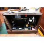 A vintage cased "Singer" Sewing machine