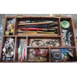 A wooden jewellery tool box containing tools, costume jewellery and assortment of other collectable