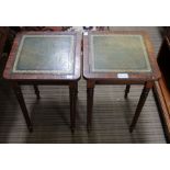 A pair of small side tables with leather insert tops