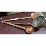 Three unusual hanging beaten copper ladle spoons