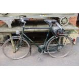 A gents green vintage Raleigh three speed gents bicycle with Brookes saddle