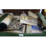 A box containing an assortment of stamps, cigarette collector cards, music rolls and other