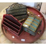 A brown Oriental tray with letter racks flutes etc