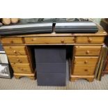 A pine twin pedestal desk with a leather insert top