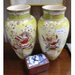 A pair of Japanese satsuma vases, having Samurai decoration, 32cm high, together with a lacquer box,