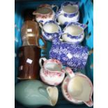 A crate of pottery jugs to include blue and white - crate to be returned