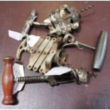 Two concertina corkscrews and two wooden handle ones, being a "Walker" and a "Columbus" type (4)