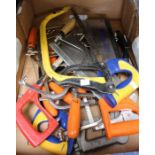 A tray of hand tools, the majority saws etc