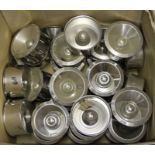 A box of Alessi stainless steel ashtrays