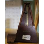 A vintage wooden cased metronome