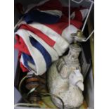A crate of mixed domestic items to include table lamps, prints, Union Jack flag, etc