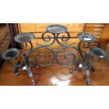 Three black candle stands/holders