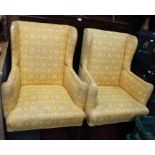 A pair of Regency design upholstered wingback armchairs on plain square tapering legs, 105cm high
