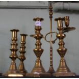 Five brass candlesticks
