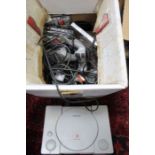 An original Sony PlayStation with multiple controllers & a selection of games