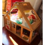 A childs wooden play house, together with assorted contents