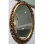 A gilt framed oval bevel plate wall mirror