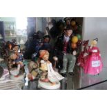 A selection of Doulton and Goebel figurines