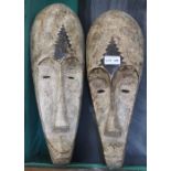 A matched pair of African carved and painted wood masks - Felix Dennis collection