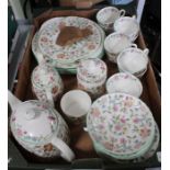 A box containing a selection of Minton Haddon Hall tea and dinner wares