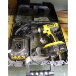 A battery Dewalt drill with charger in carrycase - sold as seen