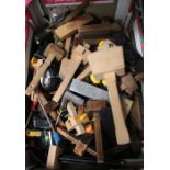 A box containing various woodworking tools, set squares block hammers etc