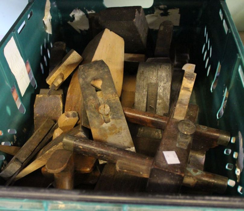 A crate containing wood block planes and associated material (crate to be returned please)