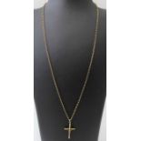 A 9ct gold crucifix suspended from a 9ct gold trace pattern chain, total weight 4.7g