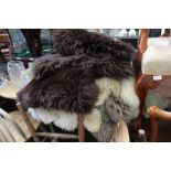 Eight sheepskin rugs, three brown, four white and one grey