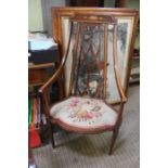 An Edwardian mahogany and satin wood inlaid high backed fancy armchair