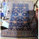 A large blue ground geometric patterned rug