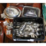 A quantity of plated cutlery, two plated tureens & a twin branch candle holder