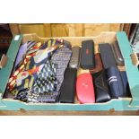 Box of ties and designer glasses cases